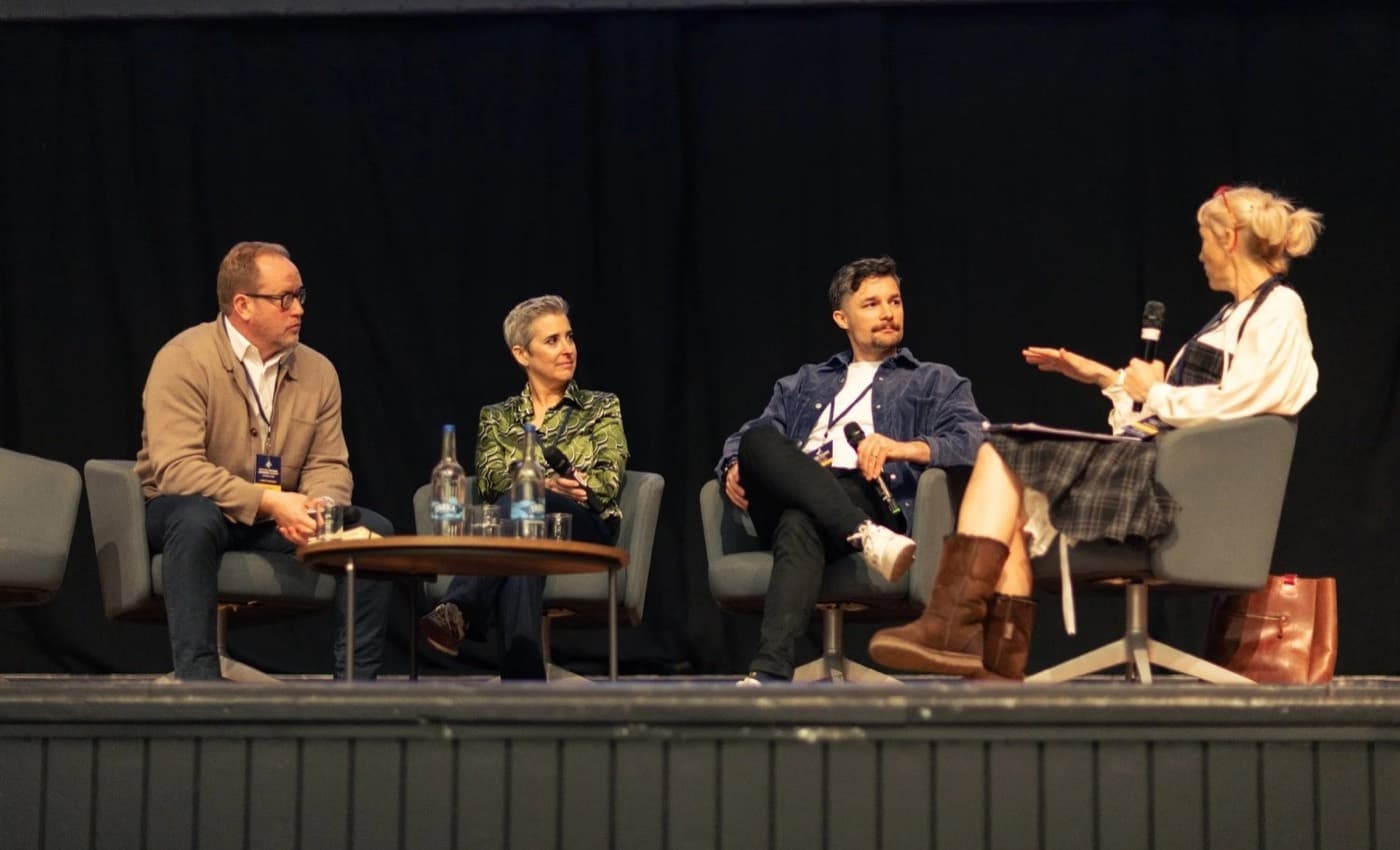 Four panellists in conversation on stage at the Future Leaders Summit