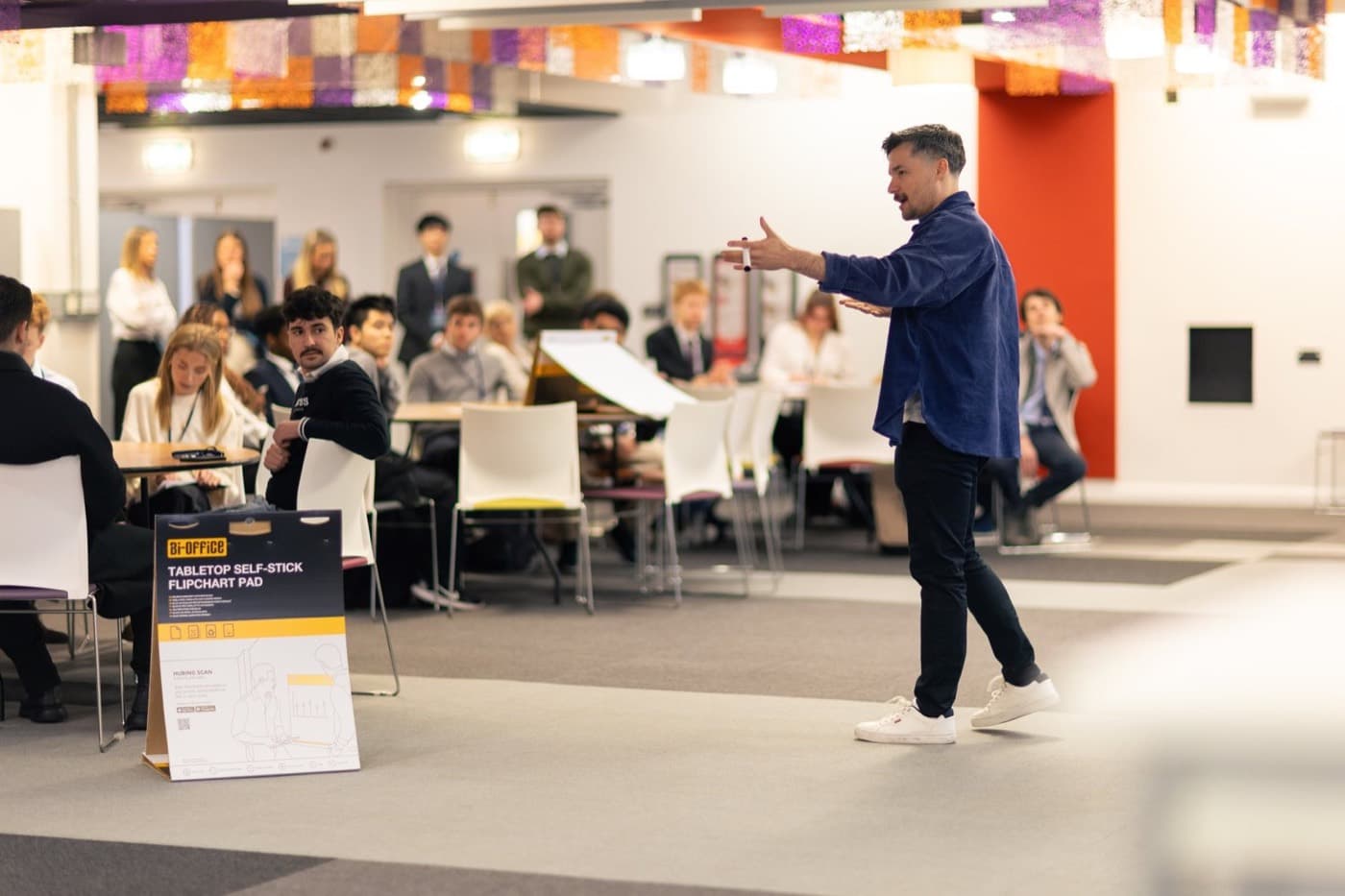 A speaker addressing students at a workshop in the Business School